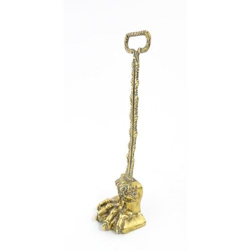 1279 - A Victorian cast brass door porter with lion paw detail. Approx. 14 1/2