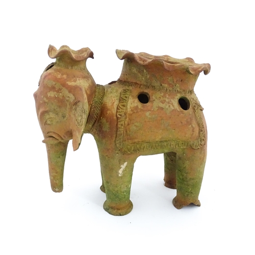 1281 - An Oriental terracotta planter modelled as an elephant. Approx. 11 3/4