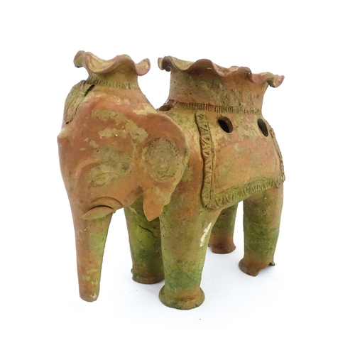 1281 - An Oriental terracotta planter modelled as an elephant. Approx. 11 3/4