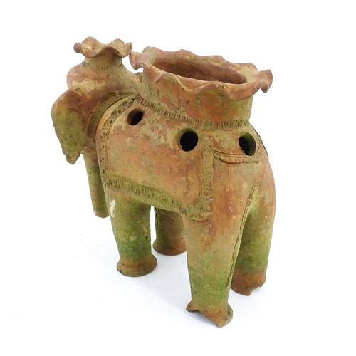 1281 - An Oriental terracotta planter modelled as an elephant. Approx. 11 3/4