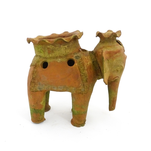 1281 - An Oriental terracotta planter modelled as an elephant. Approx. 11 3/4