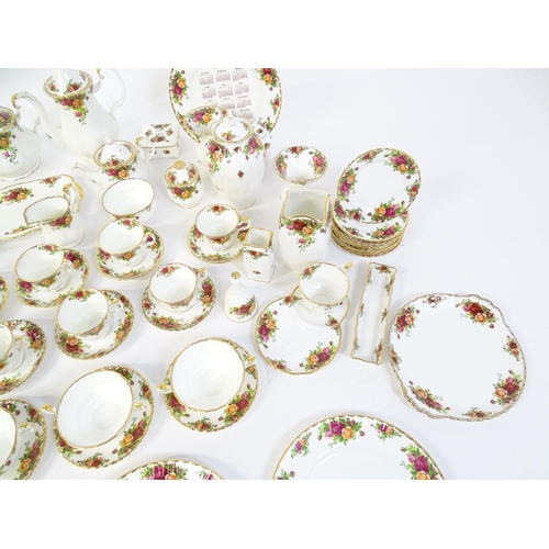 193 - A quantity of Royal Albert dinner and tea wares decorated in the Old Country Roses pattern to includ... 