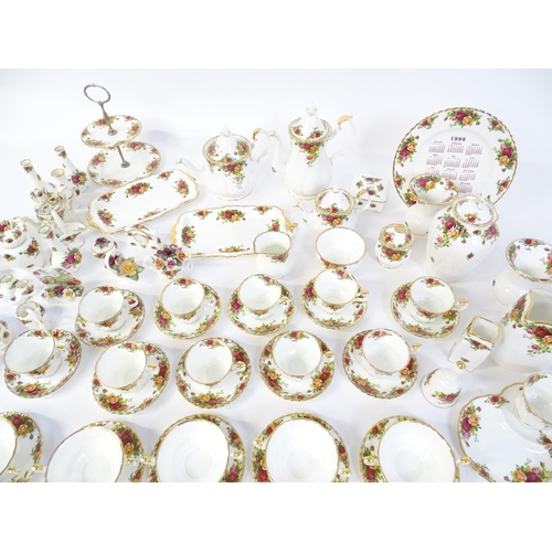 193 - A quantity of Royal Albert dinner and tea wares decorated in the Old Country Roses pattern to includ... 