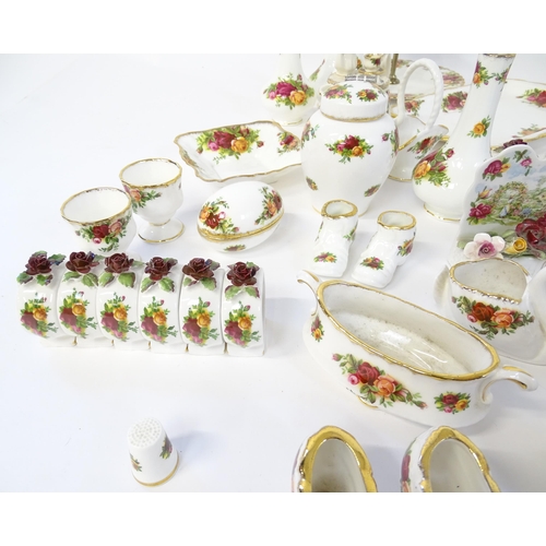 193 - A quantity of Royal Albert dinner and tea wares decorated in the Old Country Roses pattern to includ... 