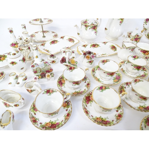 193 - A quantity of Royal Albert dinner and tea wares decorated in the Old Country Roses pattern to includ... 