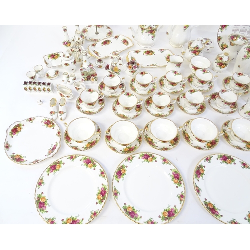 193 - A quantity of Royal Albert dinner and tea wares decorated in the Old Country Roses pattern to includ... 