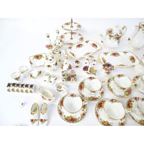 193 - A quantity of Royal Albert dinner and tea wares decorated in the Old Country Roses pattern to includ... 