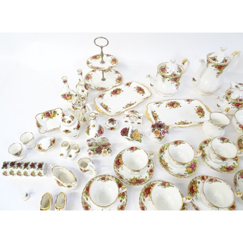 193 - A quantity of Royal Albert dinner and tea wares decorated in the Old Country Roses pattern to includ... 