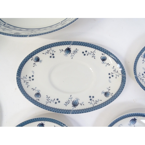 194 - A quantity of Royal Doulton dinner wares decorated in the Cambridge pattern to include plates, servi... 