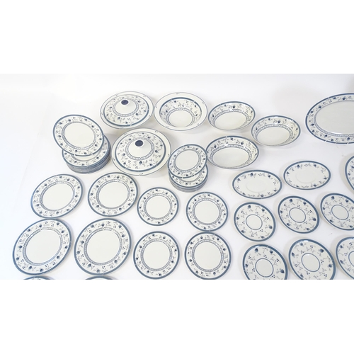 194 - A quantity of Royal Doulton dinner wares decorated in the Cambridge pattern to include plates, servi... 