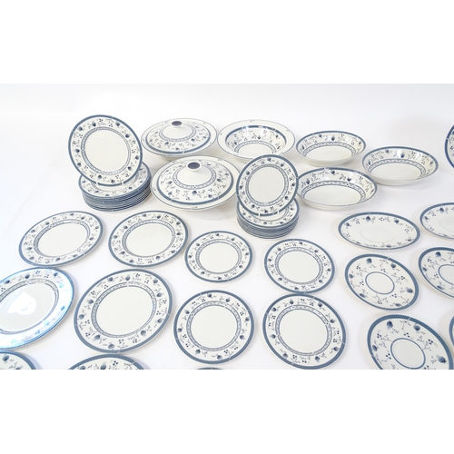 194 - A quantity of Royal Doulton dinner wares decorated in the Cambridge pattern to include plates, servi... 