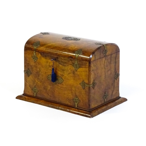1259 - A late Victorian burr walnut table casket, with pierced brass strapwork and a hinged lid. Bearing pl... 