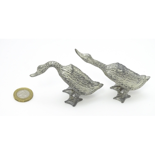 525 - A pair of silver plate models of geese. Approx. 2 1/2