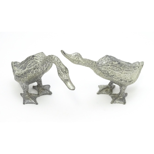 525 - A pair of silver plate models of geese. Approx. 2 1/2