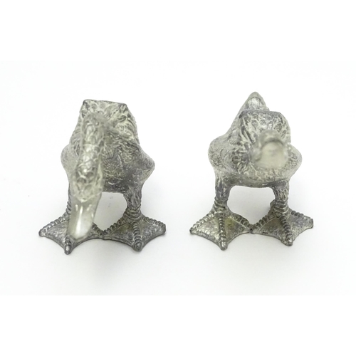 525 - A pair of silver plate models of geese. Approx. 2 1/2