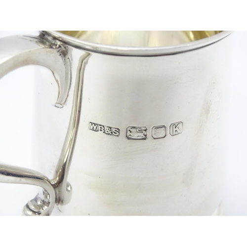 527A - A silver mug hallmarked London 1945, maker William Bruford & Son. Approx. 3 1/4