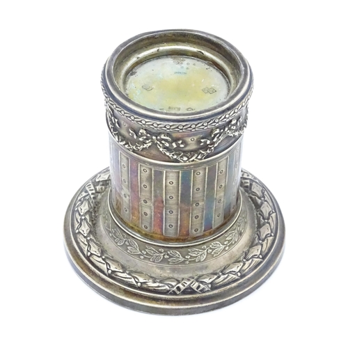 528 - A German .800 silver candle stand of squat column form with swag detail. Approx. 3