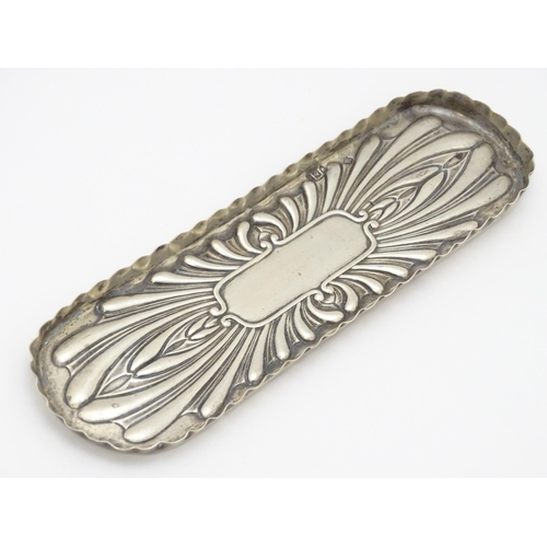 530 - A Victorian silver pen dish / tray with embossed decoration hallmarked London 1897, maker William Hu... 