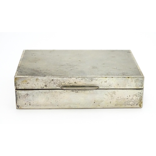 531 - A Continental .800 silver cigarette box with engine turned decoration and wood lined interior. Appro... 