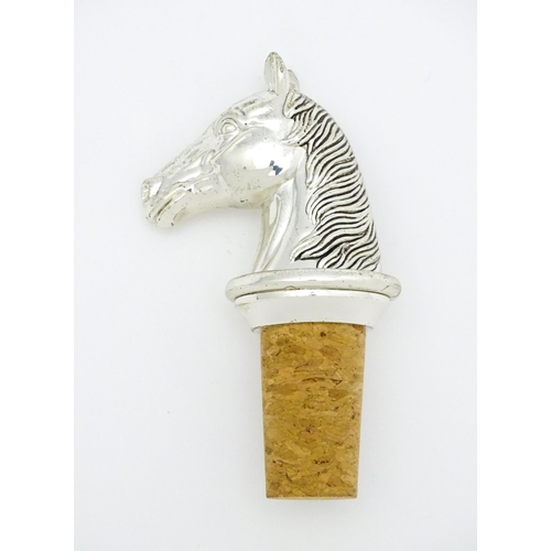 538 - A bottle stopper with silver plate horse head. Approx. 3 1/2