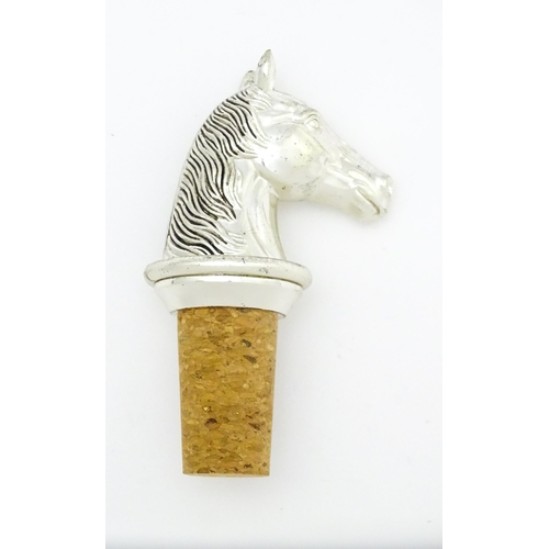 538 - A bottle stopper with silver plate horse head. Approx. 3 1/2