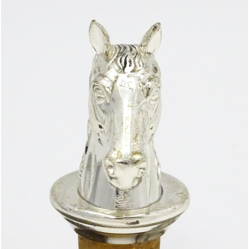 538 - A bottle stopper with silver plate horse head. Approx. 3 1/2