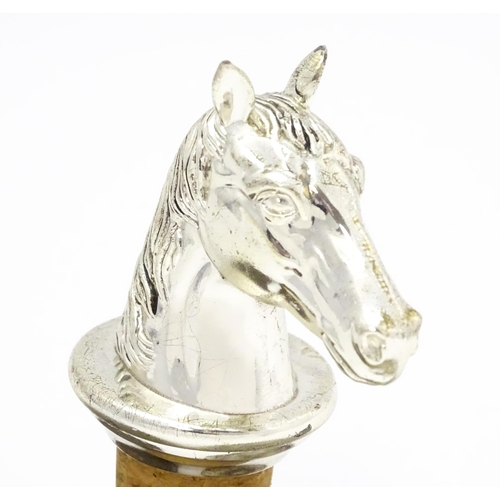 538 - A bottle stopper with silver plate horse head. Approx. 3 1/2