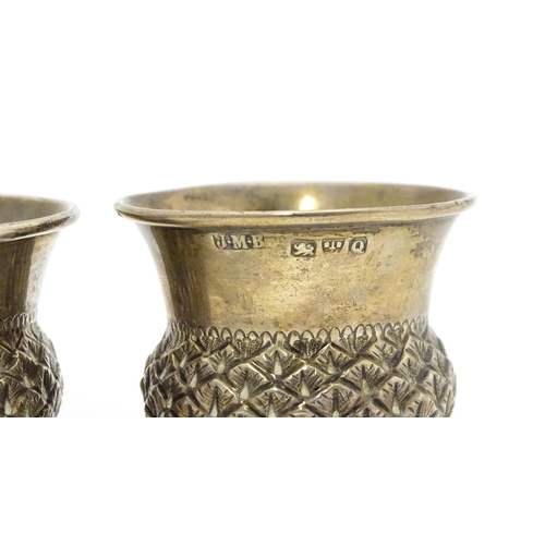 539A - A pair of Victorian silver salts of stylised thistle form, hallmarked Chester 1899, maker John Millw... 