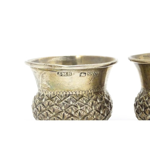 539A - A pair of Victorian silver salts of stylised thistle form, hallmarked Chester 1899, maker John Millw... 