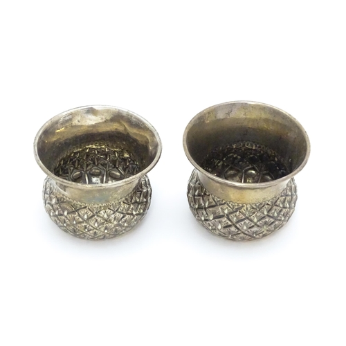 539A - A pair of Victorian silver salts of stylised thistle form, hallmarked Chester 1899, maker John Millw... 