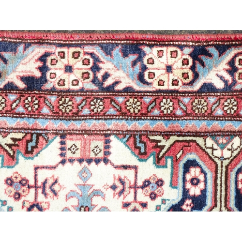 1517 - Carpet / Rug : A Persian Ardebil runner, the cream ground with floral and geometric repeating detail... 