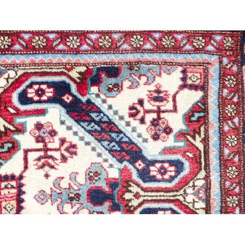 1517 - Carpet / Rug : A Persian Ardebil runner, the cream ground with floral and geometric repeating detail... 