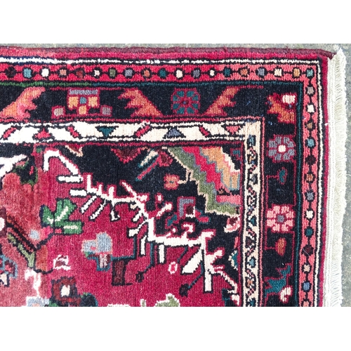 1518 - Carpet / Rug : A Persian Hamadan runner, the red ground with central cream ground medallion with flo... 