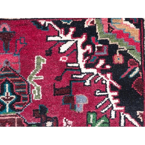 1518 - Carpet / Rug : A Persian Hamadan runner, the red ground with central cream ground medallion with flo... 