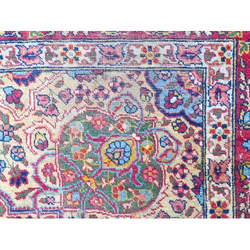 1502 - Carpet / Rug : A blue and cream ground rug profusely decorated with scrolling floral and foliate dec... 