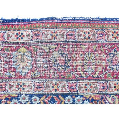 1502 - Carpet / Rug : A blue and cream ground rug profusely decorated with scrolling floral and foliate dec... 