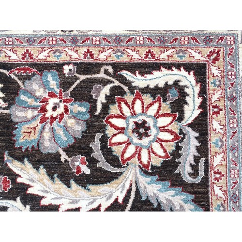 1506 - Carpet / Rug : A cream and black ground rug decorated with central medallion bordered by scrolling f... 