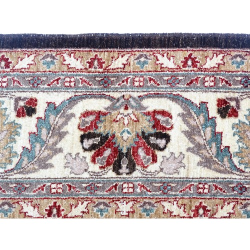 1506 - Carpet / Rug : A cream and black ground rug decorated with central medallion bordered by scrolling f... 