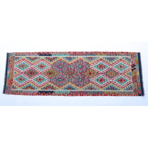 1508 - Carpet / Rug: A Turkish Anatolian kilim runner with repeated geometric decoration. Approx. 100