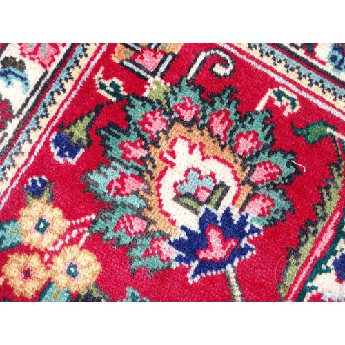 1521 - Carpet / Rug: A North West Persian Tabriz carpet the red ground with central cream and blue medallio... 