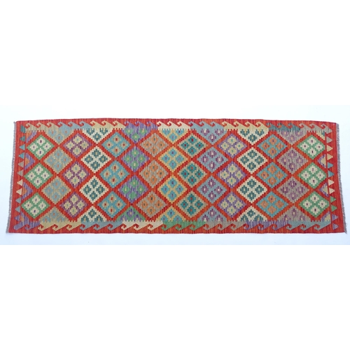 1510 - Carpet / Rug: A Turkish Anatolian kilim decorated with geometric motifs. Approx. 97