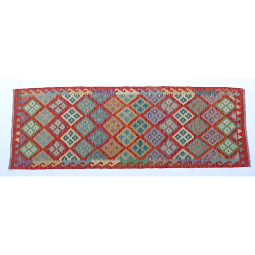 1510 - Carpet / Rug: A Turkish Anatolian kilim decorated with geometric motifs. Approx. 97