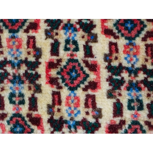 1514 - Carpet / Rug: A North West Persian Senneh runner the navy ground decorated with repeating geometric ... 