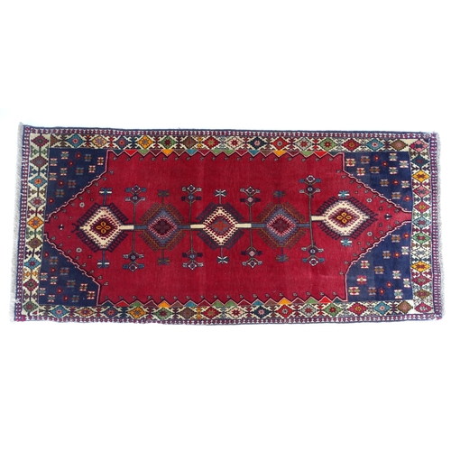 1516 - Carpet / Rug: A South West Persian Qashqai rug the red ground decorated with geometric motifs. Appro... 