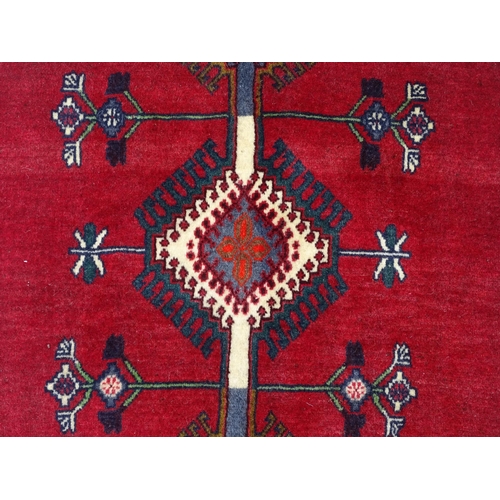 1516 - Carpet / Rug: A South West Persian Qashqai rug the red ground decorated with geometric motifs. Appro... 