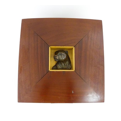 1287 - A 20thC mahogany box with inset limited edition bronze model of a leopard to top by South African sc... 