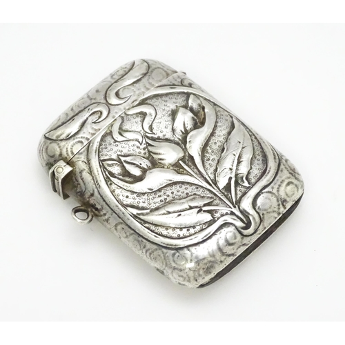 458 - An Art Nouveau white metal vesta case with embossed floral detail. Approx. 2