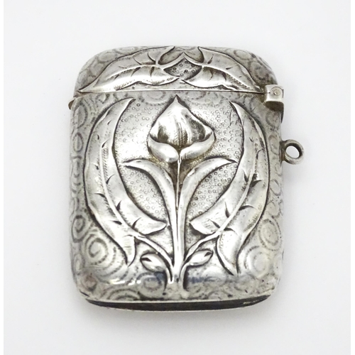 458 - An Art Nouveau white metal vesta case with embossed floral detail. Approx. 2