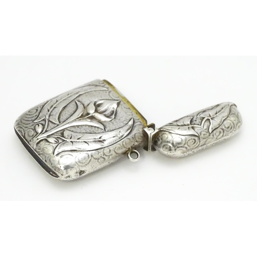 458 - An Art Nouveau white metal vesta case with embossed floral detail. Approx. 2