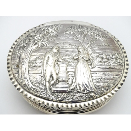 460 - WITHDRAWN FROM AUCTION
A Geo III silver lidded box decorated with embossed landscape scene to top wi... 